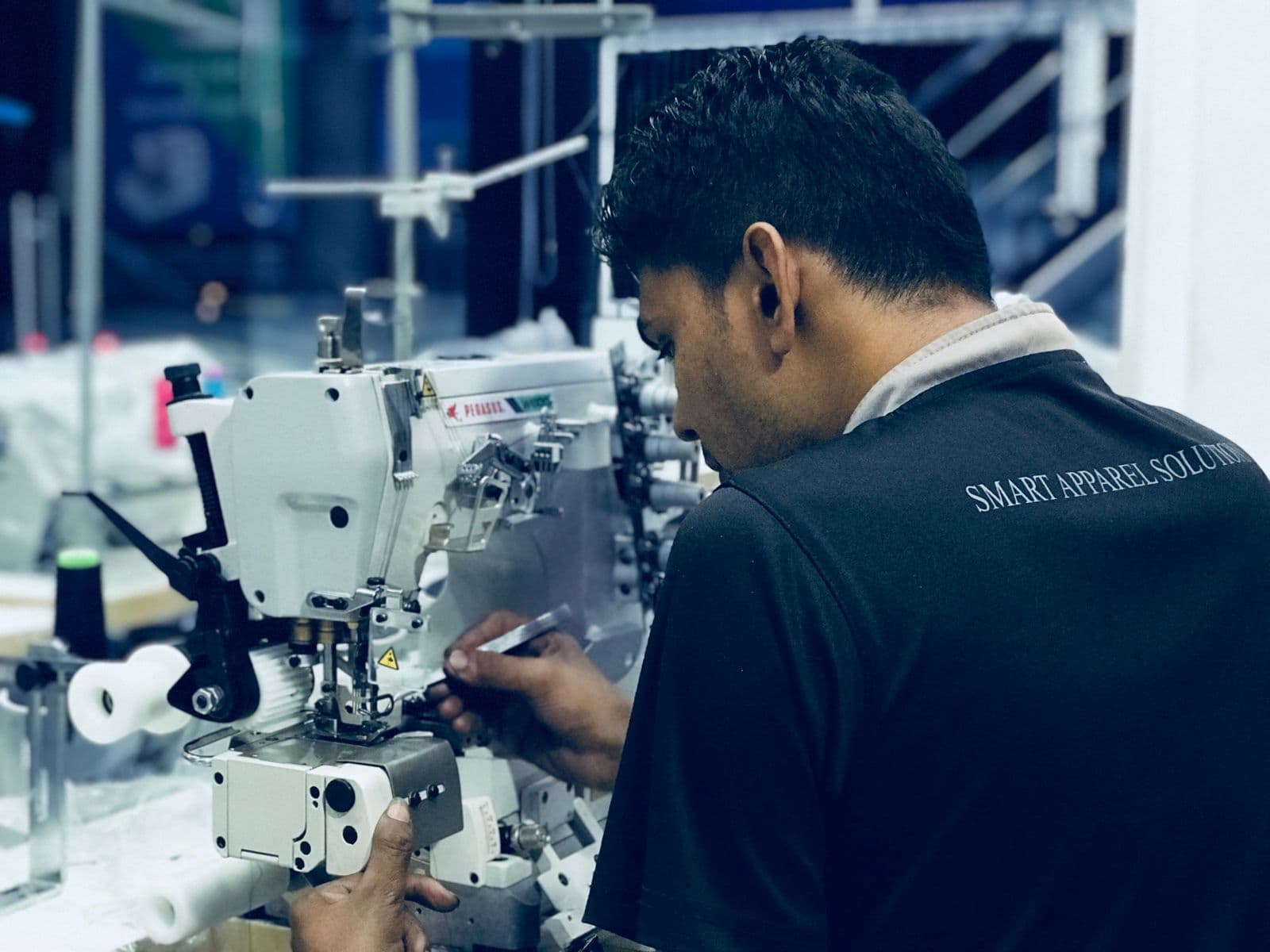 Technician repairing a sewing machine